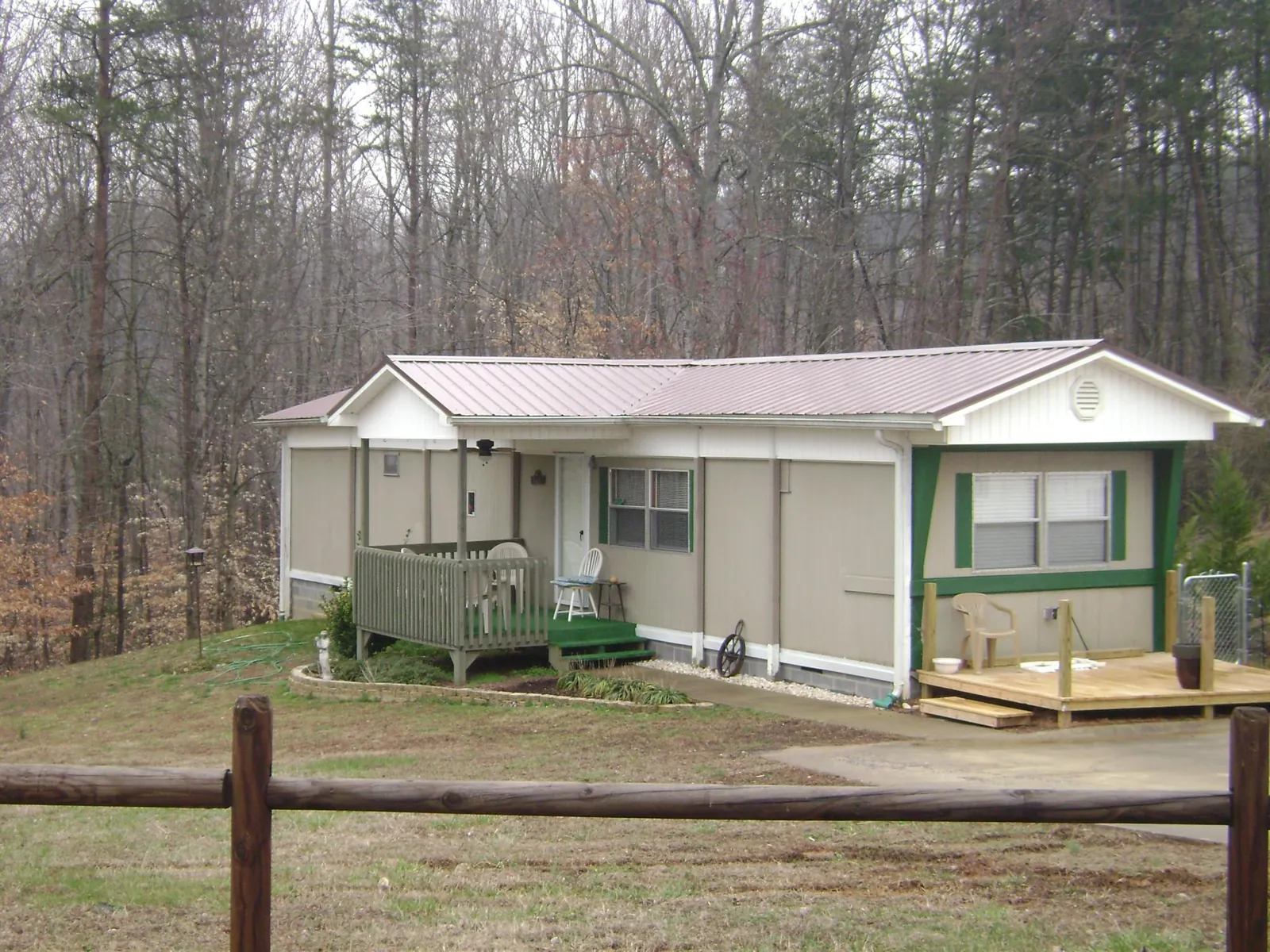 Mauve metal roof on a manufactured home with a new front deck in Saint Clair